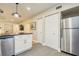 Updated kitchen with stainless steel appliances and white cabinets at 492 Santa Cruz Ne Pl # D, St Petersburg, FL 33703