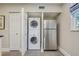 Convenient laundry room with washer, dryer, and refrigerator at 492 Santa Cruz Ne Pl # D, St Petersburg, FL 33703