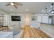 Open living space with hardwood floors and kitchen island at 492 Santa Cruz Ne Pl # D, St Petersburg, FL 33703