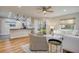 Open concept living and kitchen area with hardwood floors at 492 Santa Cruz Ne Pl # D, St Petersburg, FL 33703