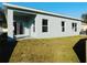 Newly constructed home with a covered patio and grassy backyard at 504 Magnolia Pointe Ct, Seffner, FL 33584
