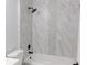 Bathroom with marble-style tile and a large shower at 504 Magnolia Pointe Ct, Seffner, FL 33584