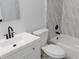 Modern bathroom featuring white vanity, toilet, and bathtub at 504 Magnolia Pointe Ct, Seffner, FL 33584