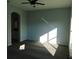 Bright bedroom with gray carpet, ceiling fan and window at 504 Magnolia Pointe Ct, Seffner, FL 33584