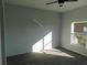 Bright bedroom with gray carpet and large window at 504 Magnolia Pointe Ct, Seffner, FL 33584