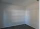 Empty bedroom with gray carpet and corner view at 504 Magnolia Pointe Ct, Seffner, FL 33584