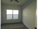 Simple bedroom with gray carpet and double window at 504 Magnolia Pointe Ct, Seffner, FL 33584
