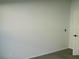 Empty bedroom with gray carpet, ceiling fan, and window at 504 Magnolia Pointe Ct, Seffner, FL 33584
