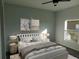 Comfortable bedroom with a queen-size bed, nightstands, and ample natural light at 504 Magnolia Pointe Ct, Seffner, FL 33584