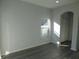 Empty dining room with gray vinyl plank flooring and window at 504 Magnolia Pointe Ct, Seffner, FL 33584