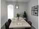 Bright dining area with a light wood table and six chairs, perfect for Gathering meals at 504 Magnolia Pointe Ct, Seffner, FL 33584