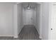 Bright entryway with gray laminate flooring and modern light fixture at 504 Magnolia Pointe Ct, Seffner, FL 33584