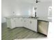 Modern kitchen with white shaker cabinets, granite countertops and stainless steel appliances at 504 Magnolia Pointe Ct, Seffner, FL 33584