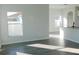 Open living room with hardwood floors and a view of the kitchen at 504 Magnolia Pointe Ct, Seffner, FL 33584