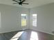 Spacious living room featuring hardwood floors and large windows at 504 Magnolia Pointe Ct, Seffner, FL 33584