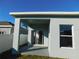 Covered patio with sliding glass doors leading to the interior at 504 Magnolia Pointe Ct, Seffner, FL 33584