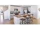 Kitchen with white cabinets, granite countertops and island at 5246 Salt Marsh Rd, Wimauma, FL 33598