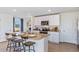 Kitchen with white cabinets, granite countertops and island at 5246 Salt Marsh Rd, Wimauma, FL 33598