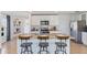 Kitchen island with seating and granite countertops at 5246 Salt Marsh Rd, Wimauma, FL 33598