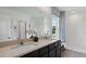 Bathroom with double vanity, large mirror and walk-in shower at 5249 Salt Marsh Rd, Wimauma, FL 33598