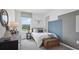 Cozy bedroom with a bed, dresser, and large window at 5249 Salt Marsh Rd, Wimauma, FL 33598