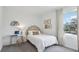Bedroom with a bed, desk, and window overlooking the yard at 5249 Salt Marsh Rd, Wimauma, FL 33598