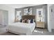 Main bedroom with king-size bed and en-suite bathroom at 5249 Salt Marsh Rd, Wimauma, FL 33598