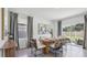 Dining room with wooden table and sliding glass doors at 5249 Salt Marsh Rd, Wimauma, FL 33598