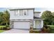 Two-story house with stone accents and a two-car garage at 5249 Salt Marsh Rd, Wimauma, FL 33598
