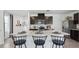 Modern kitchen with dark cabinets and an island at 5249 Salt Marsh Rd, Wimauma, FL 33598
