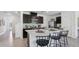 Modern kitchen with dark cabinets and an island at 5249 Salt Marsh Rd, Wimauma, FL 33598