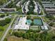 Aerial view of community with pool and tennis courts at 5725 80Th N St # 116, St Petersburg, FL 33709