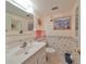 Half bathroom with pedestal sink and toilet at 5725 80Th N St # 116, St Petersburg, FL 33709