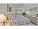 Bedroom with queen bed, dresser, and nightstands at 5725 80Th N St # 116, St Petersburg, FL 33709