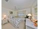 Bedroom with queen bed and plenty of natural light at 5725 80Th N St # 116, St Petersburg, FL 33709
