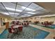 Large community room with multiple tables at 5725 80Th N St # 116, St Petersburg, FL 33709
