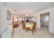 Bright dining room with table and chairs, adjacent to living area at 5725 80Th N St # 116, St Petersburg, FL 33709
