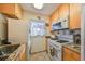 Bright kitchen with granite countertops and modern appliances at 5725 80Th N St # 116, St Petersburg, FL 33709
