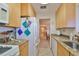 Galley kitchen features granite countertops and ample cabinetry at 5725 80Th N St # 116, St Petersburg, FL 33709