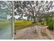 Private patio with table and chairs, overlooking a grassy area at 5725 80Th N St # 116, St Petersburg, FL 33709