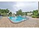 Community pool with plenty of lounge chairs at 5725 80Th N St # 116, St Petersburg, FL 33709