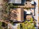 Aerial view of a house and surrounding yard, including a shed and trees at 6327 2Nd S Ave, St Petersburg, FL 33707