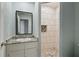 Clean bathroom with tiled shower and granite countertop at 6327 2Nd S Ave, St Petersburg, FL 33707