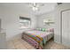 Bright bedroom with a comfy bed and colorful bedding at 6327 2Nd S Ave, St Petersburg, FL 33707