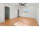 Well-lit bedroom with hardwood floors and access to a bathroom at 6327 2Nd S Ave, St Petersburg, FL 33707