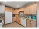 Bright kitchen with wood cabinets and granite countertops at 6327 2Nd S Ave, St Petersburg, FL 33707