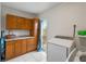 Laundry room with wood cabinets and washer/dryer hookups at 6327 2Nd S Ave, St Petersburg, FL 33707