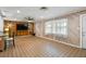 Open living area with wood-paneled walls and tile flooring at 6327 2Nd S Ave, St Petersburg, FL 33707
