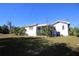 View of the home's side with a screened porch at 801 Woodruff Ave, Clearwater, FL 33756