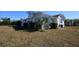 White single story home with teal shutters at 801 Woodruff Ave, Clearwater, FL 33756